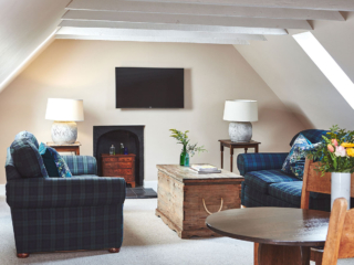 The open plan living and dining room in the eaves in the Attic Apartment part of Brambles hotel in Inveraray in Scotland