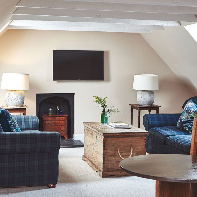 The open plan living and dining room in the eaves in the Attic Apartment part of Brambles of Inveraray Hotel in Scotland