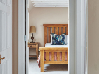 The hallway into the double bedroom in the eaves in the Attic Apartment part of Brambles hotel in Inveraray in Scotland