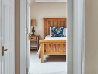 The hallway into the double bedroom in the eaves in the Attic Apartment part of Brambles hotel in Inveraray in Scotland