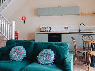 The open plan living room and kitchen in the Campbell Apartment part of Brambles hotel in Inveraray in Scotland