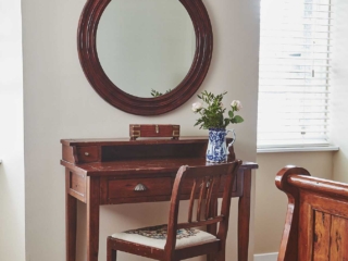 An antique dressing table in a Deluxe Room in Brambles hotel in Inveraray in Scotland