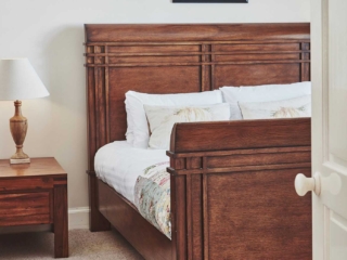 A stunning antique double bed at Lochview Apartment part of Brambles hotel in Inveraray in Scotland