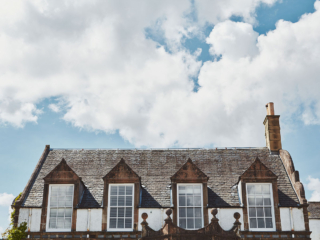 The exterior of the upper section of the old building of Lochview Apartment part of Brambles hotel in Inveraray in Scotland