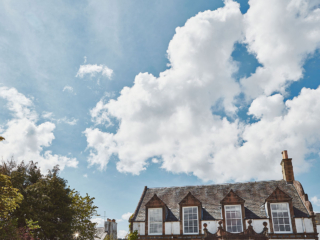 The exterior of the upper section of the old building of Lochview Apartment part of Brambles hotel in Inveraray in Scotland